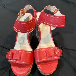 Pair of Red Nine West wedge sandal